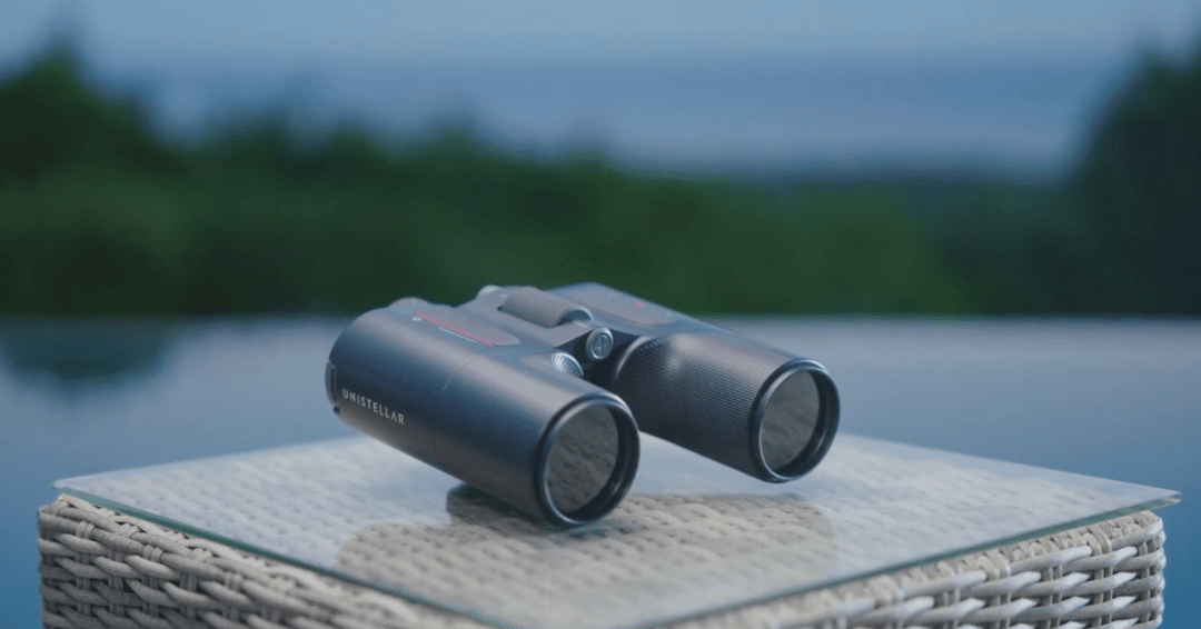 (Credit: Unistellar) Unistellar binoculars placed on a table.