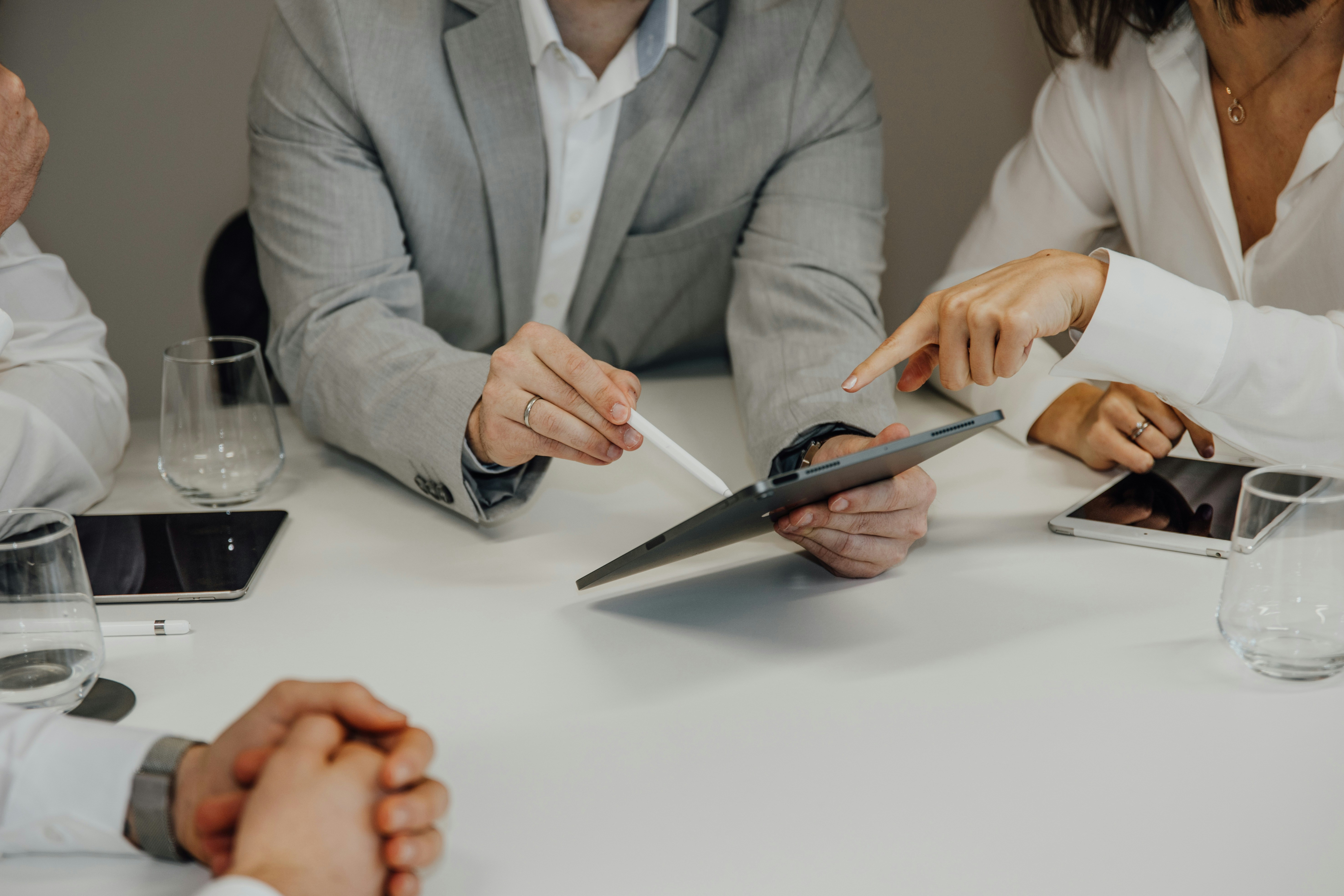 Image of a meeting where people in an office are collaborating on a project. Representing a B2B PR agency.
